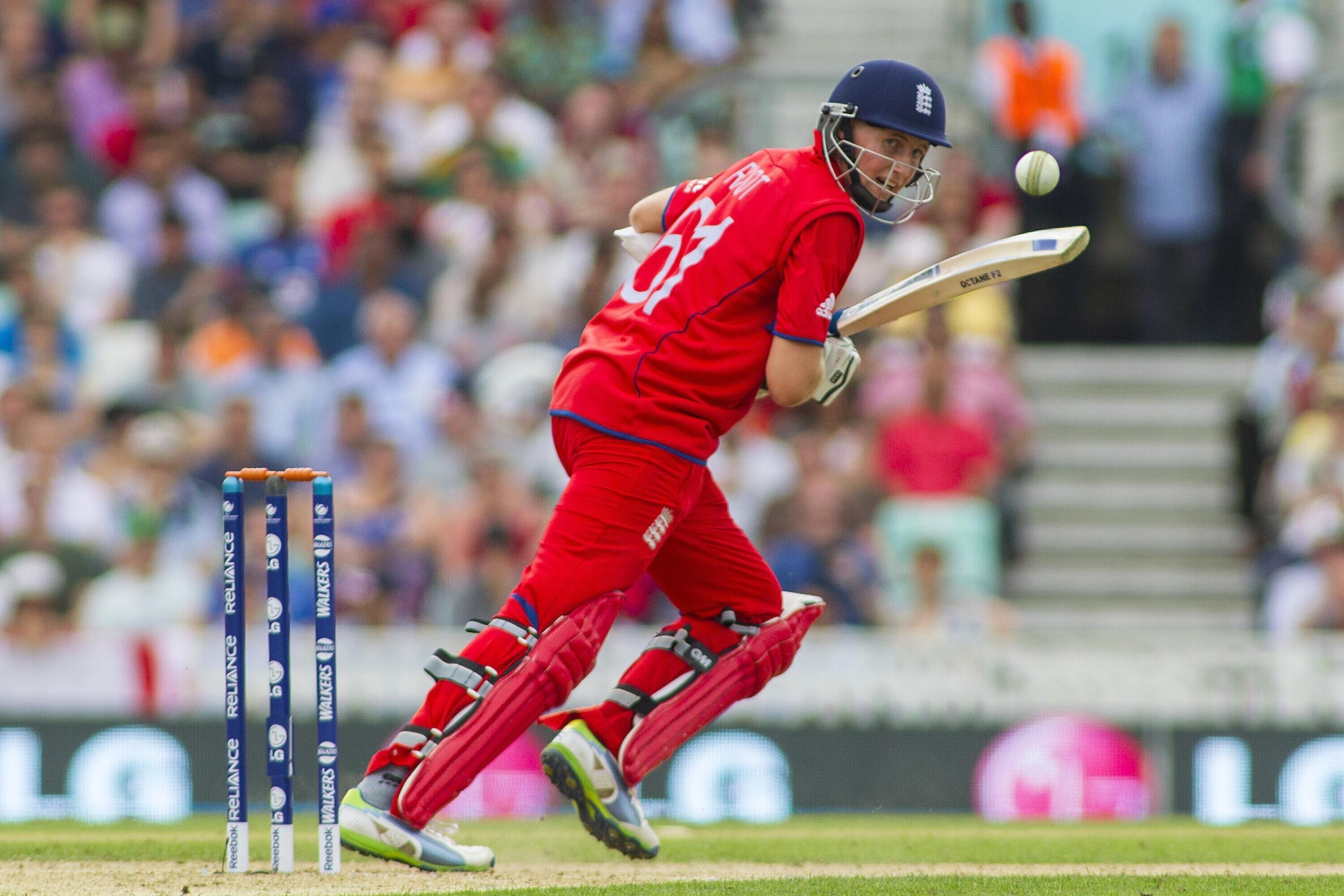 Joe Root running on the wicket in red kit