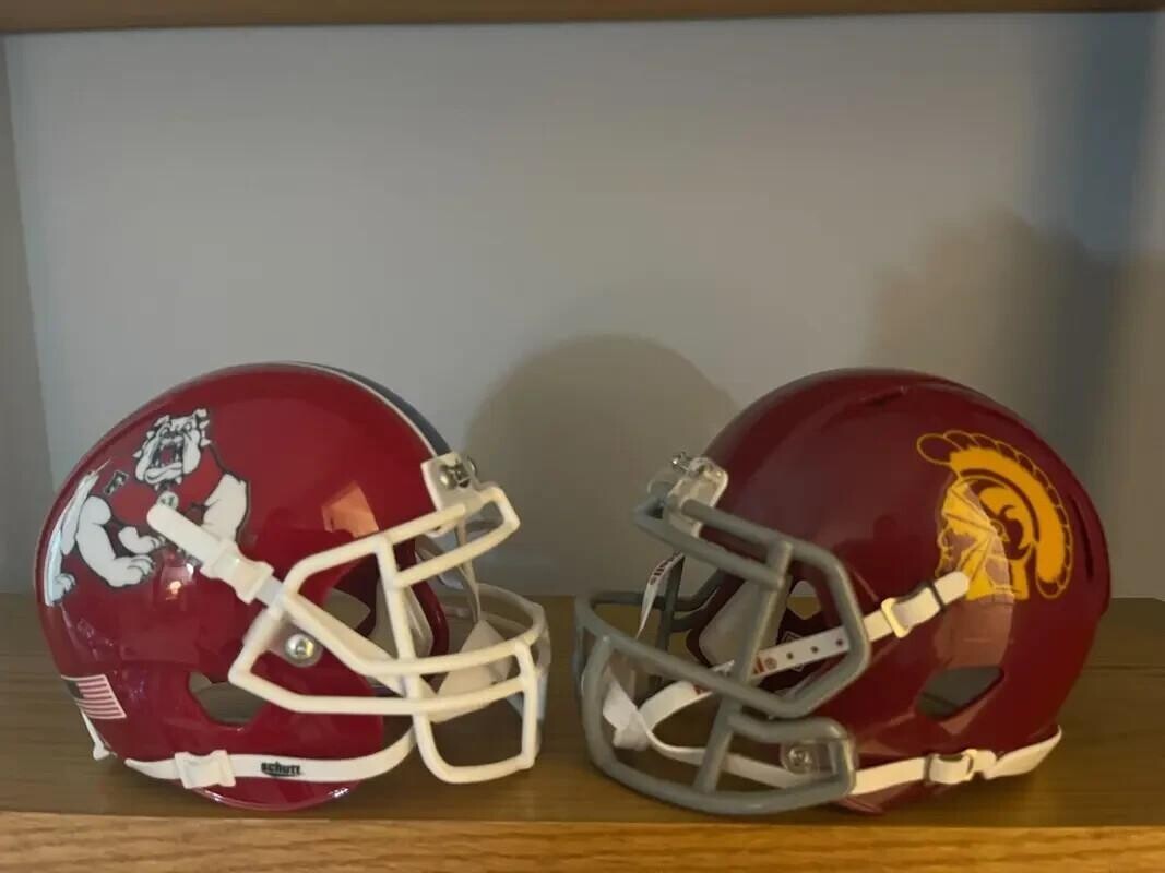 Fresno state and USC College football helmets