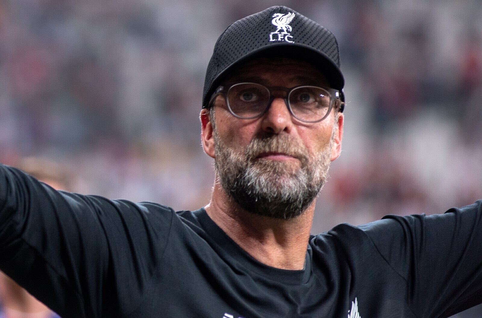 Liverpool manager Jurgen Klopp in black shirt and LFC Cap