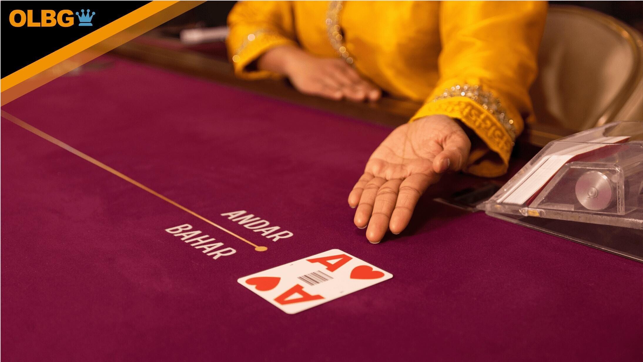A dealer turns the cards at an Andar Bahar table