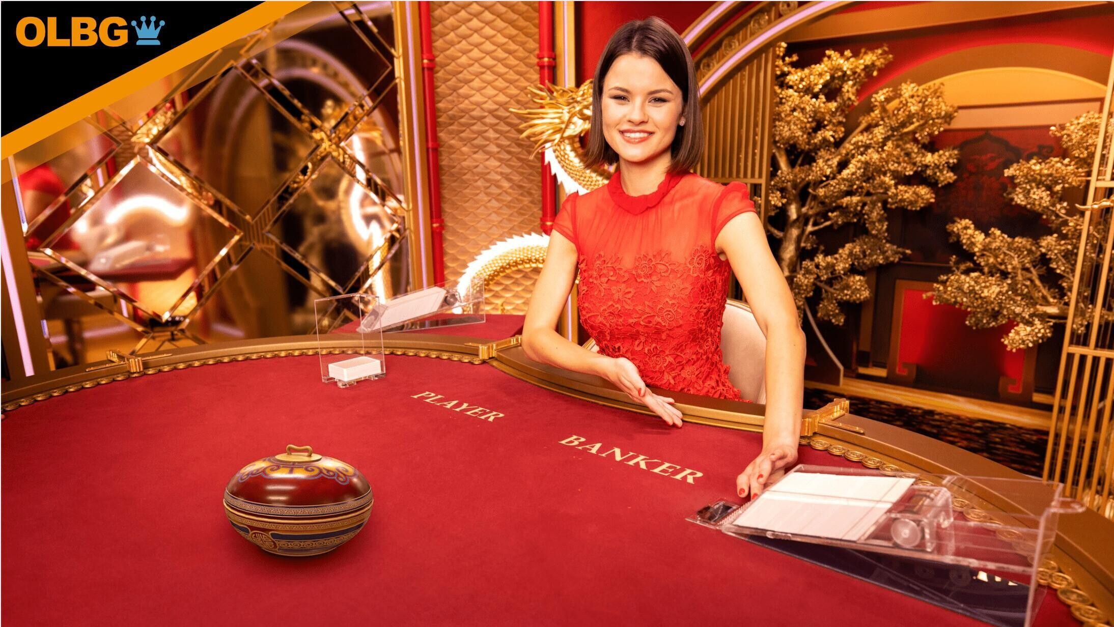 A dealer gets the action started on the Golden Wealth Baccarat table