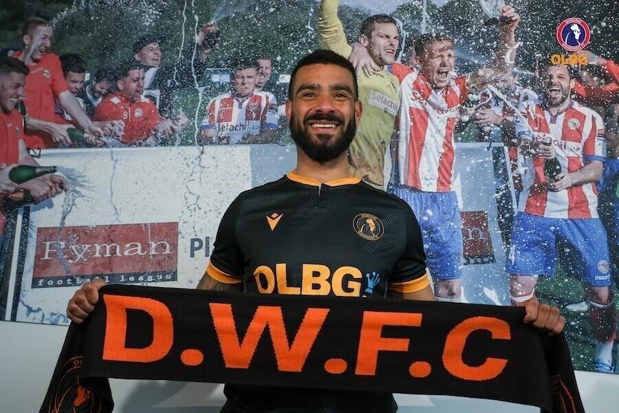 Dorking Wanderers signing Paul McCallum poses with an OLBG scarf