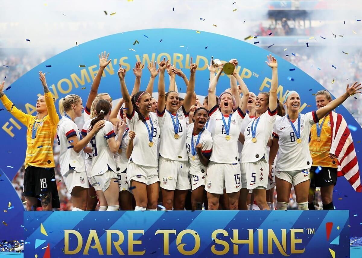United States celebrating winning the FIFA trophy