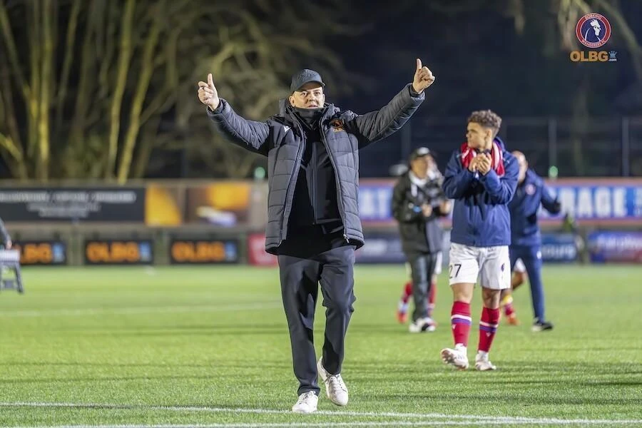 Dorking Wanderers manager Marc White, saluting the adoring crowd