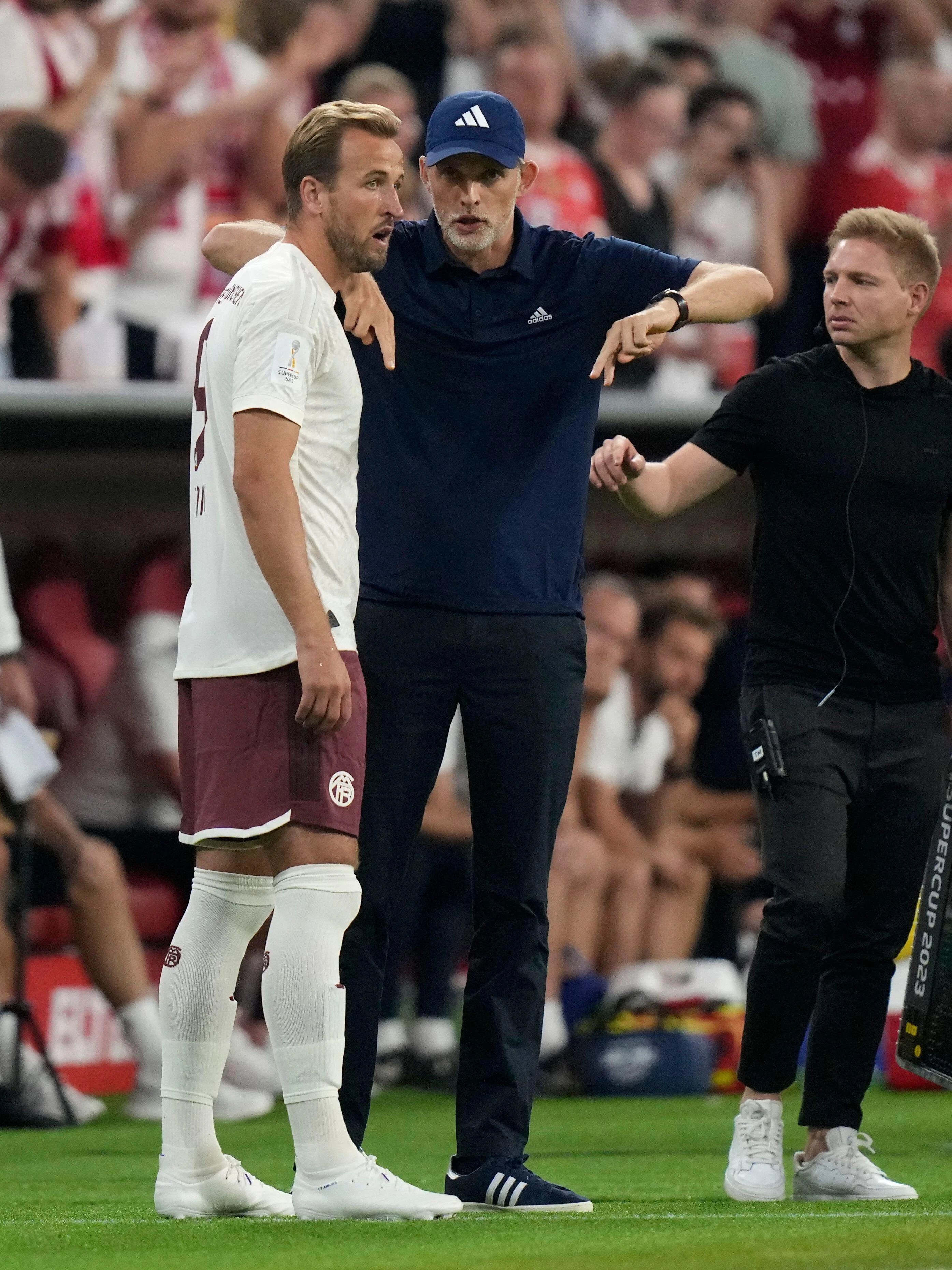 England manager Thomas Tuchel giving instruction to England's Harry kane on the pitch side