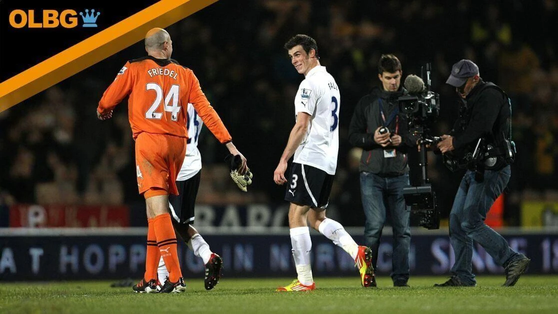 Tottenham Hotspur goalkeeper Brad Friedel (left) and Gareth Bale celebrate after the final whistle