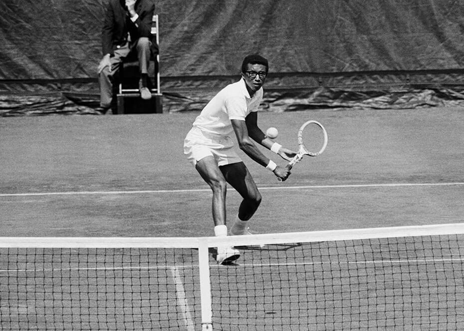 Arthur Ashe playing tennis